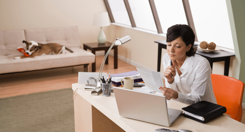 woman work from home set up with dog