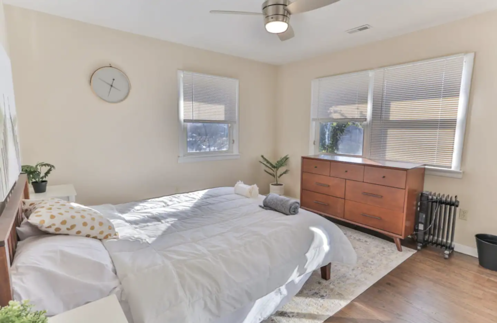 Bedroom #2 features a queen-sized bed, a dresser, a large closet, and a ceiling fan.