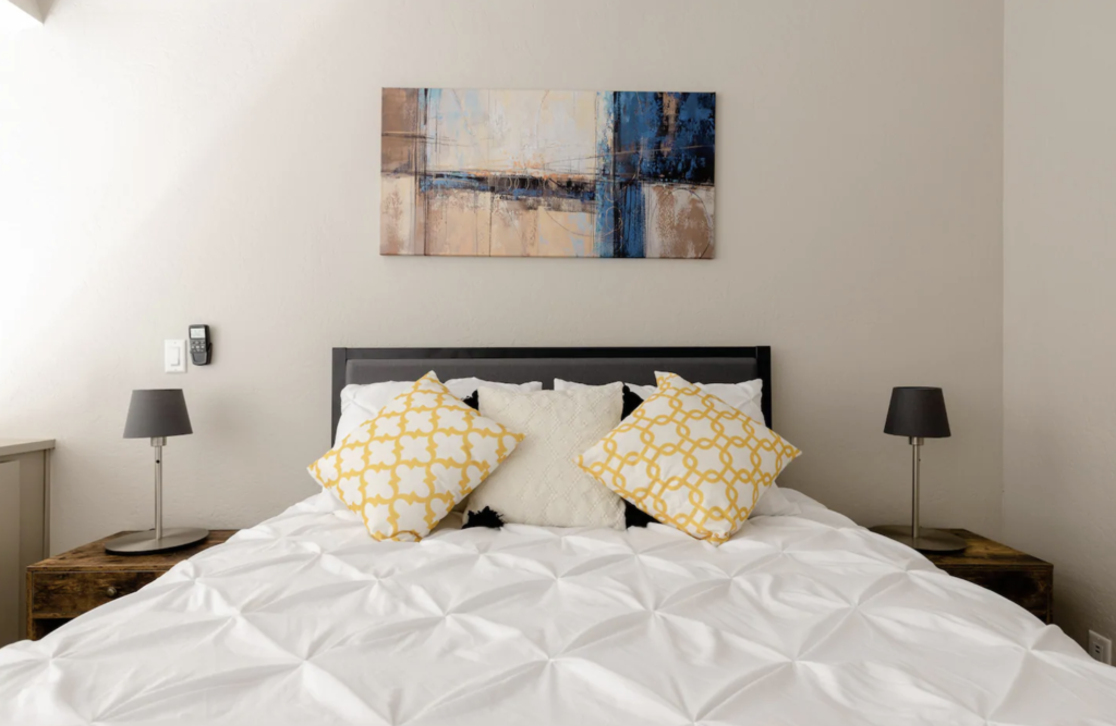 another bedroom with standard textile sheets